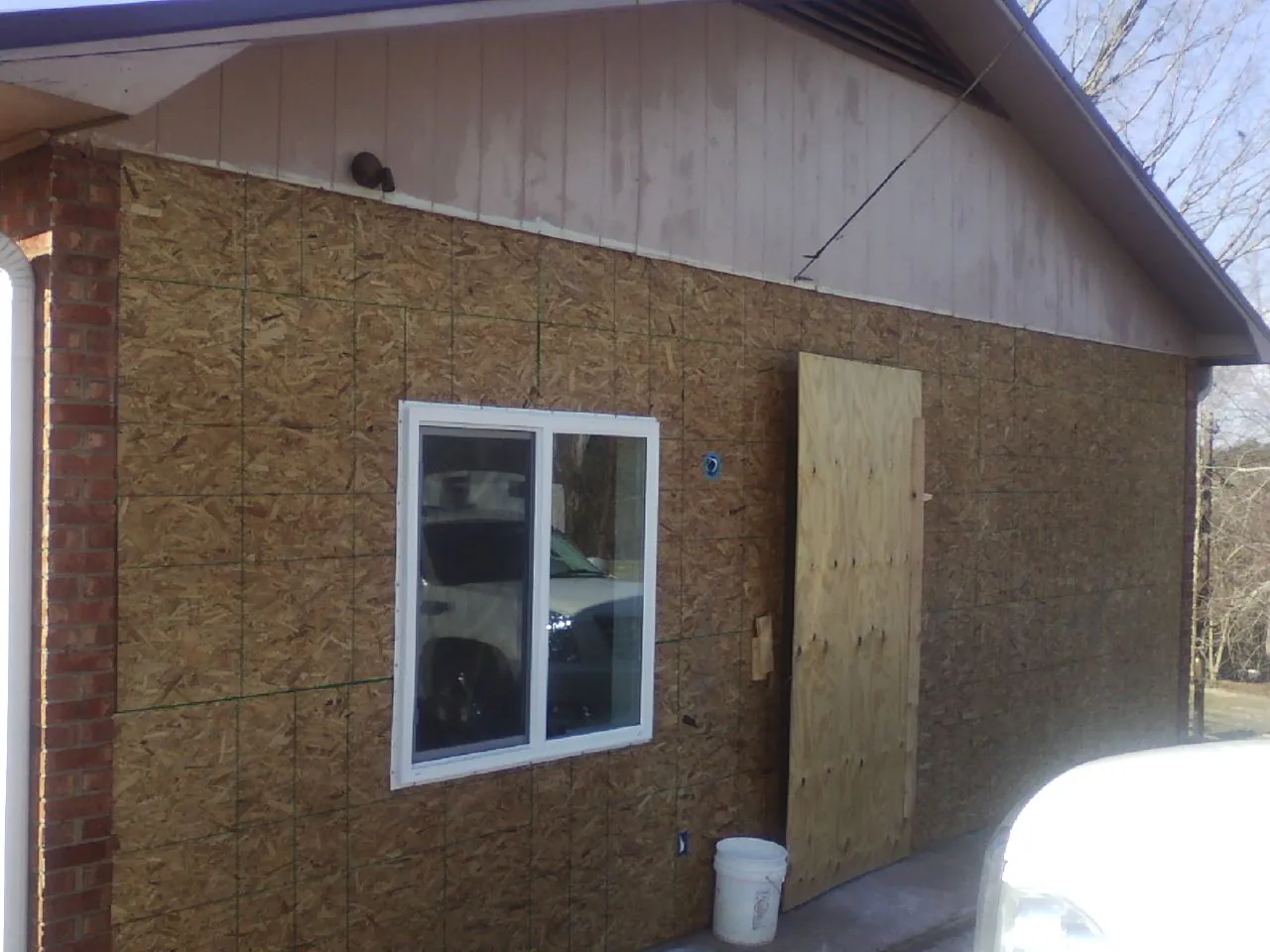 OSB sheathing on a garage addition wall before siding in Nephi